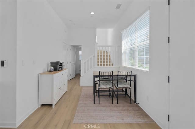 4565 S Bryant Paseo Ln, Ontario, CA 91762 - dining space featuring light wood finished floors, stairs, baseboards, and recessed lighting