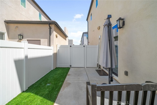 4565 S Bryant Paseo Ln, Ontario, CA 91762 - view of yard with fence, a gate, and a patio