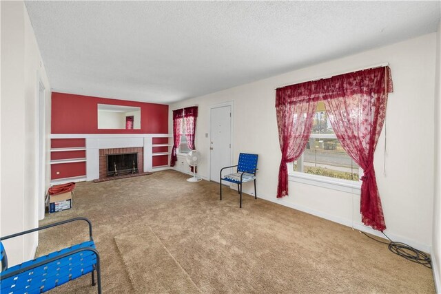 527 W Olive Ave, Monrovia, CA 91016 - unfurnished room featuring carpet, a textured ceiling, a brick fireplace, and baseboards