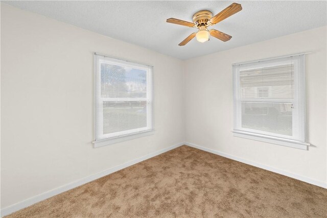 527 W Olive Ave, Monrovia, CA 91016 - empty room with carpet floors, ceiling fan, and baseboards