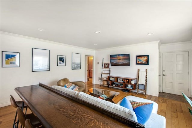 living area featuring crown molding, wood-type flooring, recessed lighting, and baseboards