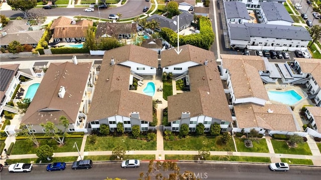 aerial view of residential area featuring a pool area