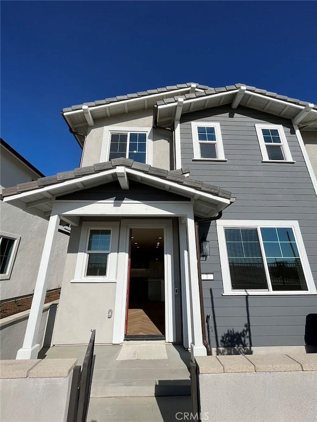 4036 E Peony Paseo Unit 7, Ontario, CA 91761 - view of front of home featuring stucco siding and a tile roof