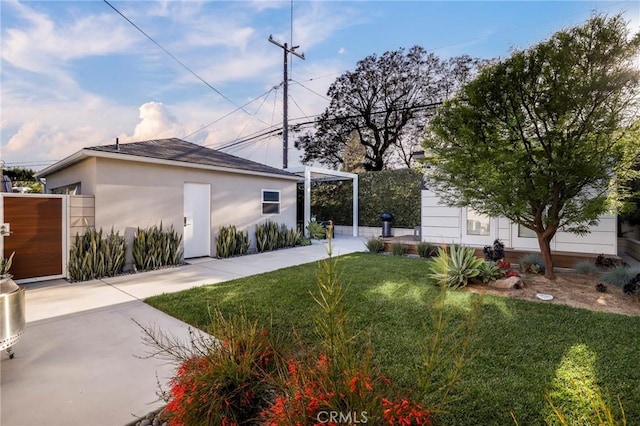 3231 Marber Ave, Long Beach, CA 90808 - view of side of property featuring stucco siding and a lawn