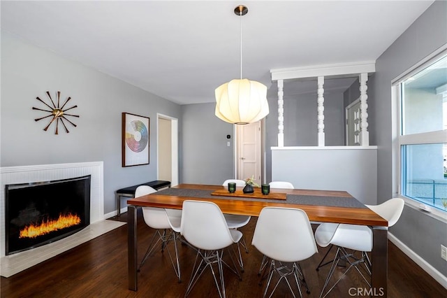 3231 Marber Ave, Long Beach, CA 90808 - dining area featuring wood finished floors, baseboards, and a brick fireplace
