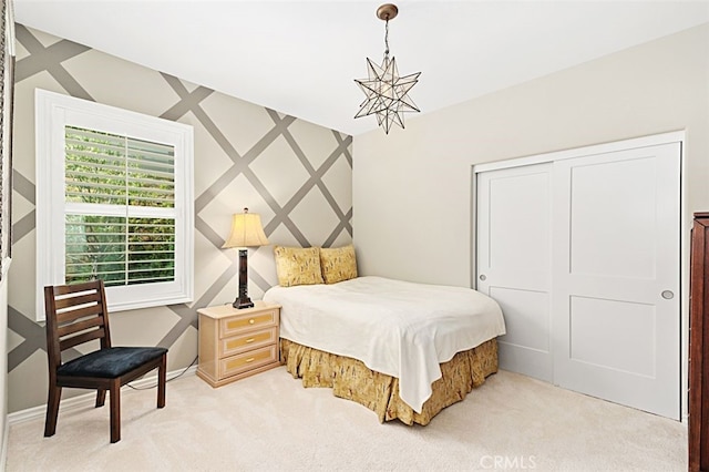 2521 Chad Zeller, Corona, CA 92882 - bedroom with light carpet, a closet, a chandelier, and baseboards