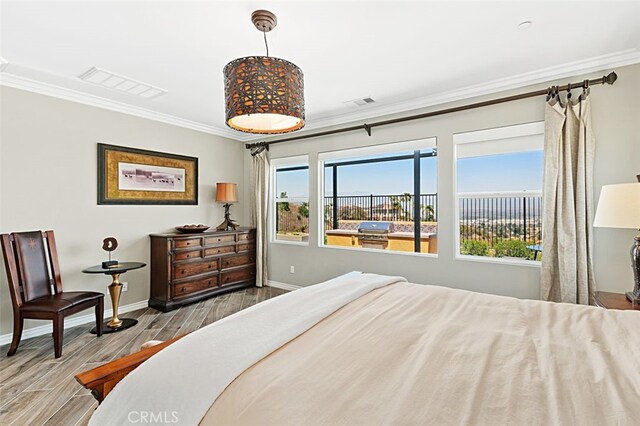 2521 Chad Zeller, Corona, CA 92882 - bedroom featuring ornamental molding, baseboards, and wood finished floors