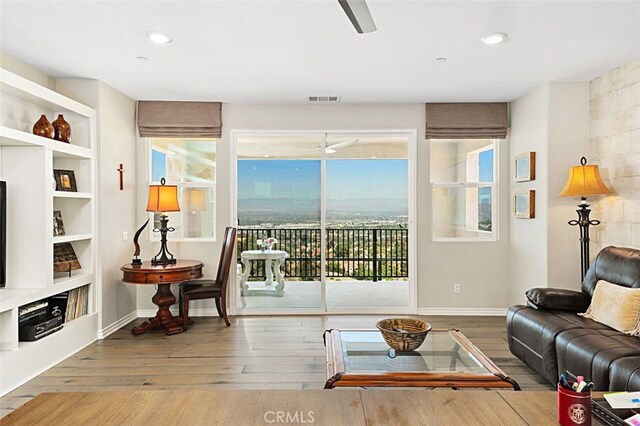 2521 Chad Zeller, Corona, CA 92882 - living area with wood finished floors, a ceiling fan, recessed lighting, baseboards, and built in features