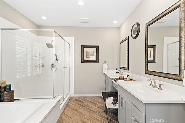 2521 Chad Zeller, Corona, CA 92882 - full bath featuring a stall shower, wood finished floors, two vanities, baseboards, and recessed lighting