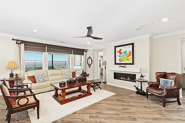 2521 Chad Zeller, Corona, CA 92882 - living area featuring ornamental molding, a ceiling fan, recessed lighting, light wood-style flooring, and baseboards