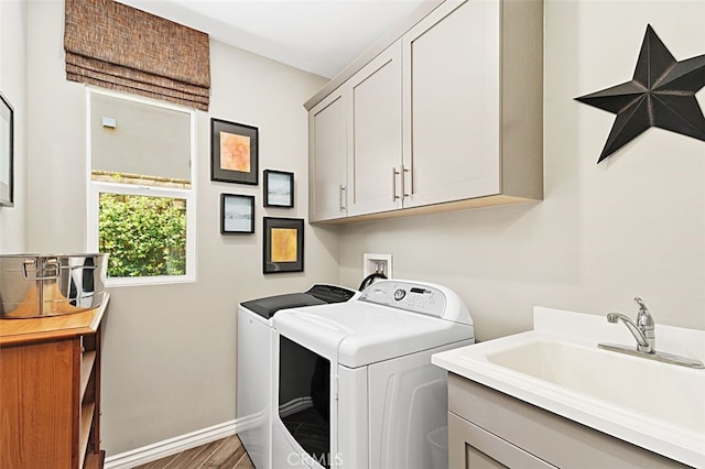2521 Chad Zeller, Corona, CA 92882 - clothes washing area featuring washing machine and dryer, cabinet space, baseboards, and wood finished floors