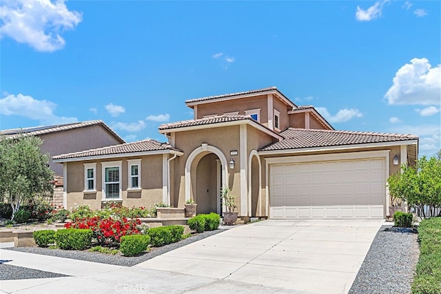 2521 Chad Zeller, Corona, CA 92882 - mediterranean / spanish house featuring an attached garage, stucco siding, concrete driveway, and a tiled roof