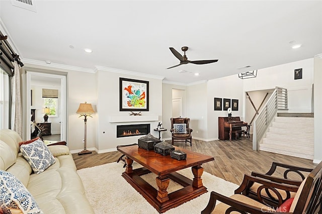 2521 Chad Zeller, Corona, CA 92882 - living area featuring ceiling fan, light wood-style floors, recessed lighting, baseboards, and stairway