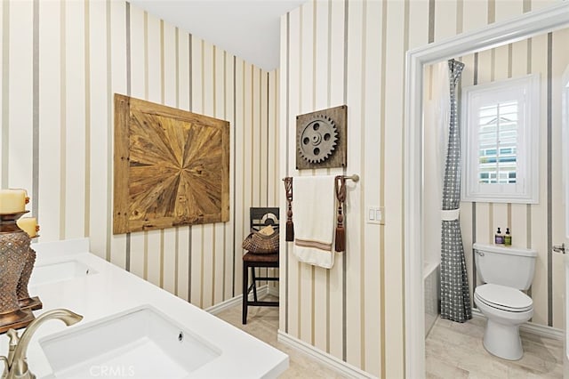 2521 Chad Zeller, Corona, CA 92882 - full bath with a sink, wallpapered walls, and toilet