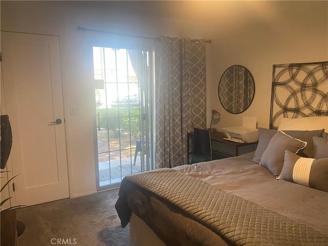 bedroom with access to exterior and dark carpet