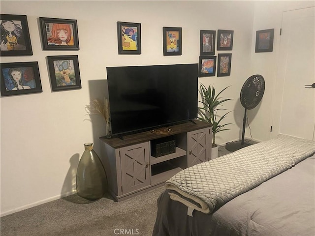 bedroom featuring carpet flooring and baseboards