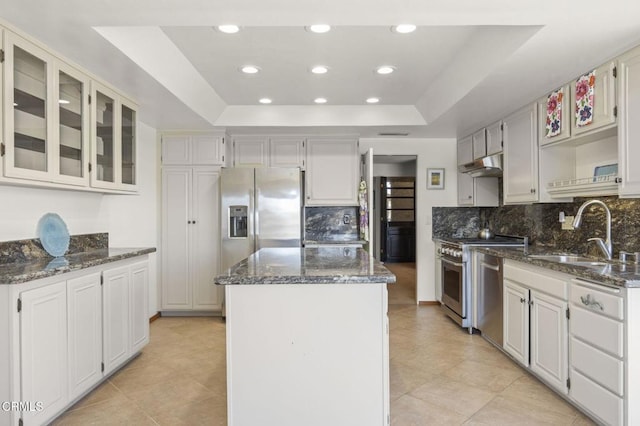 2120 Jamestown Way, Oxnard, CA 93035 - kitchen with a sink, under cabinet range hood, appliances with stainless steel finishes, a center island, and a raised ceiling