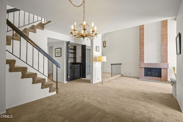 2120 Jamestown Way, Oxnard, CA 93035 - unfurnished living room with carpet flooring, stairs, a chandelier, and a fireplace
