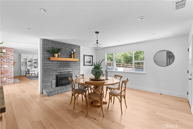 1804 Deer Canyon Rd, Arroyo Grande, CA 93420 - dining space featuring a fireplace, light wood finished floors, baseboards, and recessed lighting