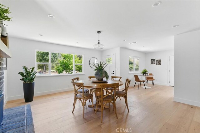 1804 Deer Canyon Rd, Arroyo Grande, CA 93420 - dining room with a stone fireplace, light wood-type flooring, baseboards, and recessed lighting