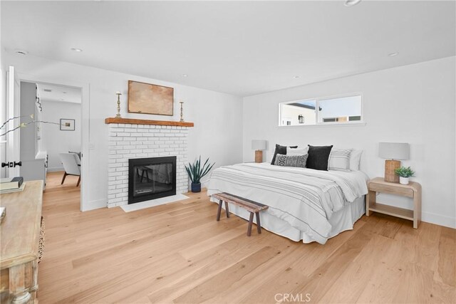 1804 Deer Canyon Rd, Arroyo Grande, CA 93420 - bedroom featuring light wood-type flooring, a fireplace, and baseboards
