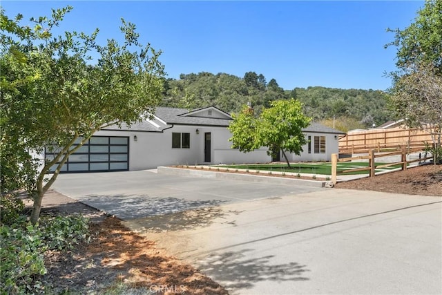 1804 Deer Canyon Rd, Arroyo Grande, CA 93420 - view of front of house featuring fence, stucco siding, driveway, and an attached garage