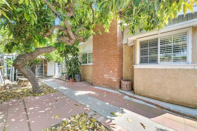 6109 N Traymore Ave, Azusa, CA 91702 - doorway to property with brick siding and a patio
