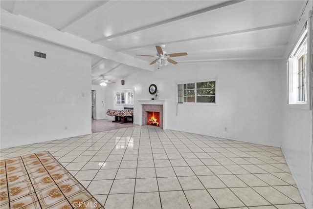 6109 N Traymore Ave, Azusa, CA 91702 - unfurnished living room featuring ceiling fan, a lit fireplace, and light tile patterned flooring