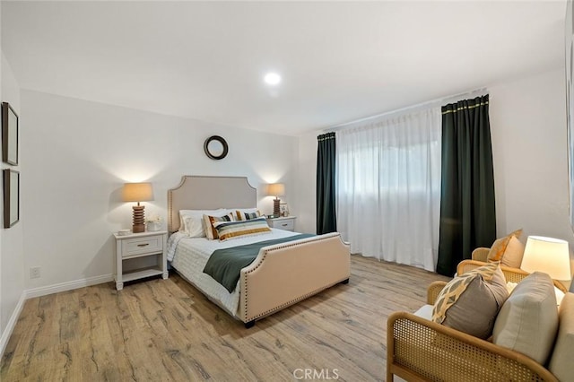 128 Fairview St Unit 1, Santa Ana, CA 92704 - bedroom featuring light wood-style flooring and baseboards