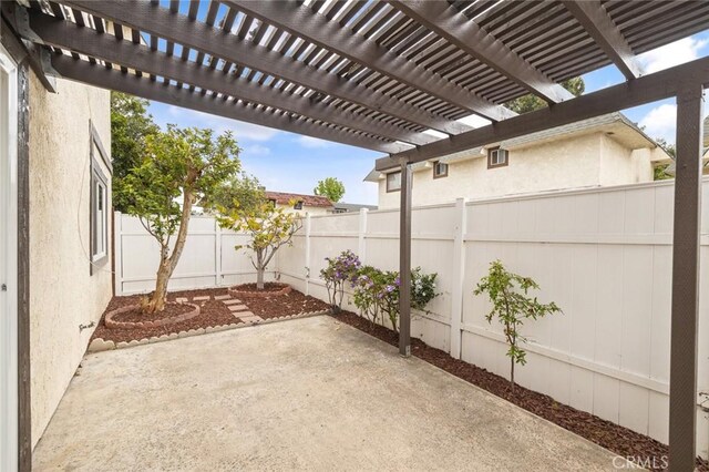 128 Fairview St Unit 1, Santa Ana, CA 92704 - view of patio / terrace with a fenced backyard and a pergola