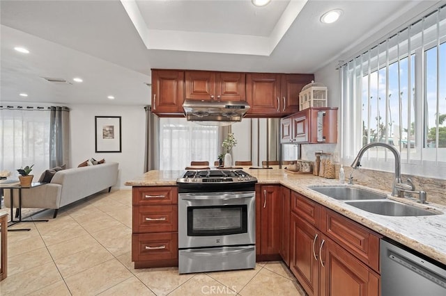 128 Fairview St Unit 1, Santa Ana, CA 92704 - kitchen with stainless steel appliances, a sink, a peninsula, a raised ceiling, and light tile patterned floors