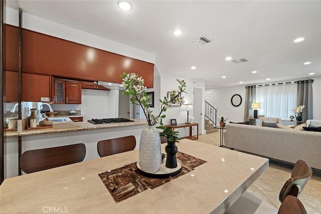 128 Fairview St Unit 1, Santa Ana, CA 92704 - dining space with recessed lighting, light tile patterned floors, and stairs