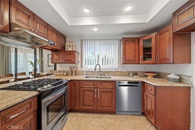 128 Fairview St Unit 1, Santa Ana, CA 92704 - kitchen with a sink, appliances with stainless steel finishes, a tray ceiling, light tile patterned floors, and healthy amount of natural light