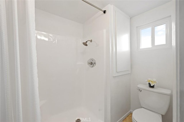 128 Fairview St Unit 1, Santa Ana, CA 92704 - bathroom with a shower with curtain, toilet, and baseboards