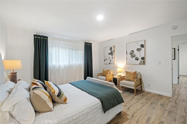 128 Fairview St Unit 1, Santa Ana, CA 92704 - bedroom with light wood-type flooring and baseboards
