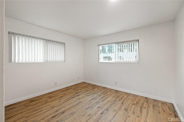 128 Fairview St Unit 1, Santa Ana, CA 92704 - spare room featuring baseboards and wood finished floors