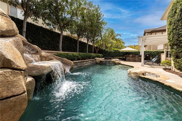 view of pool featuring a patio area and a pergola