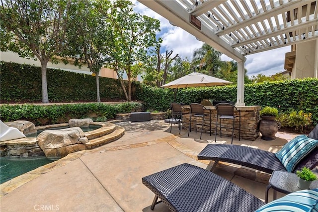 view of patio featuring a jacuzzi and a pergola