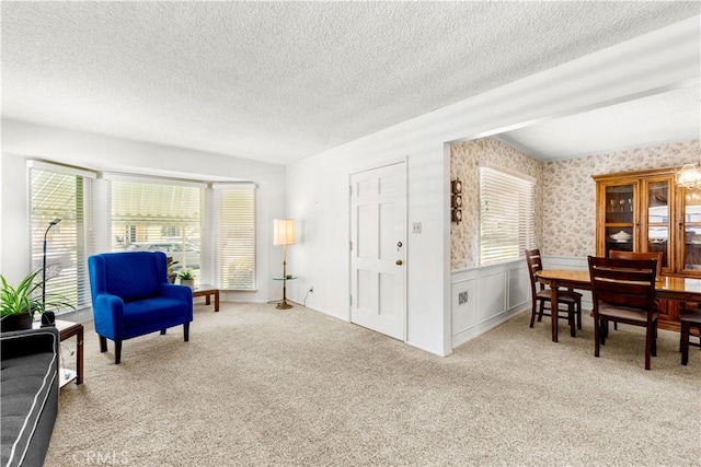10608 Beak Ave, South Gate, CA 90280 - living area featuring a textured ceiling, carpet, a wainscoted wall, and wallpapered walls