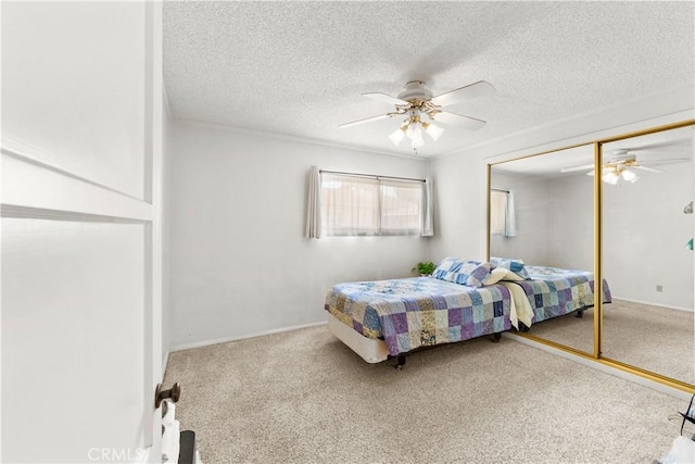 10608 Beak Ave, South Gate, CA 90280 - bedroom with carpet floors, a textured ceiling, a closet, and a ceiling fan