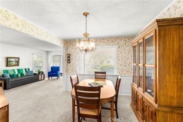 10608 Beak Ave, South Gate, CA 90280 - dining room with wallpapered walls, wainscoting, a chandelier, and carpet