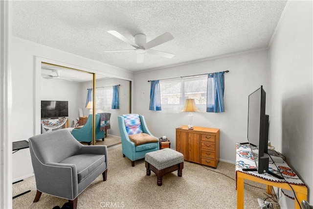 10608 Beak Ave, South Gate, CA 90280 - sitting room featuring ceiling fan, a textured ceiling, light colored carpet, and baseboards