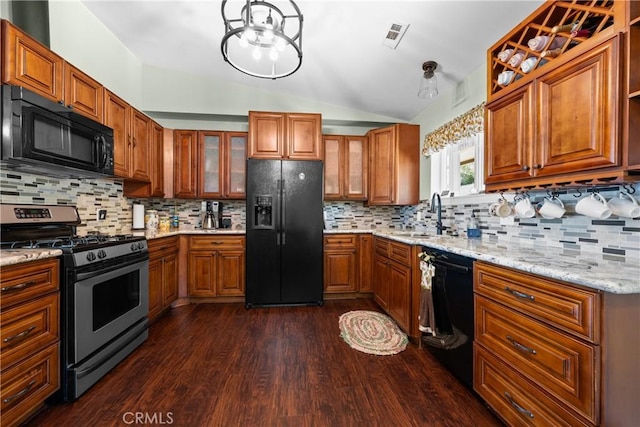 7525 Starlight Way, Julian, CA 92036 - kitchen with black appliances, a sink, vaulted ceiling, brown cabinetry, and dark wood-style flooring