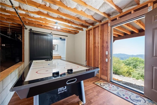 7525 Starlight Way, Julian, CA 92036 - recreation room featuring wood finished floors, a mountain view, and a barn door