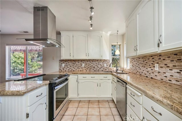 15632 Little Peak Rd, Hidden Valley Lake, CA 95467 - kitchen featuring appliances with stainless steel finishes, exhaust hood, a sink, a peninsula, and light tile patterned floors