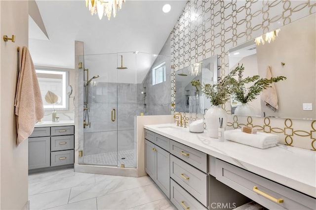 22602 Manalastas Dr, Lake Forest, CA 92630 - full bathroom with a shower stall, marble look tile flooring, vanity, and a chandelier