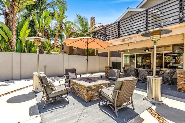22602 Manalastas Dr, Lake Forest, CA 92630 - view of patio featuring a balcony, an outdoor fire pit, and fence