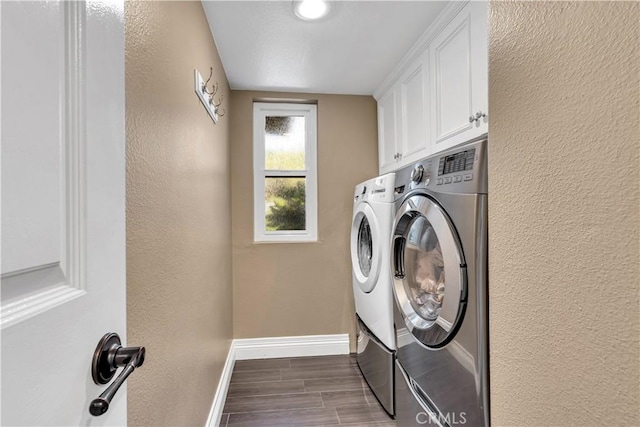22602 Manalastas Dr, Lake Forest, CA 92630 - laundry area with washer and clothes dryer, baseboards, cabinet space, dark wood-style flooring, and a textured wall