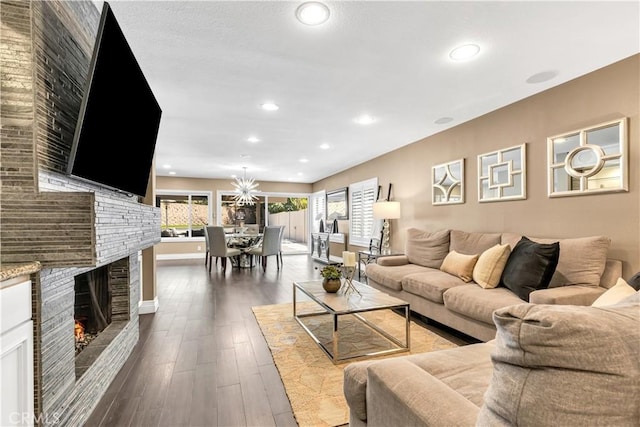 22602 Manalastas Dr, Lake Forest, CA 92630 - living area with a brick fireplace, dark wood-style floors, recessed lighting, and baseboards