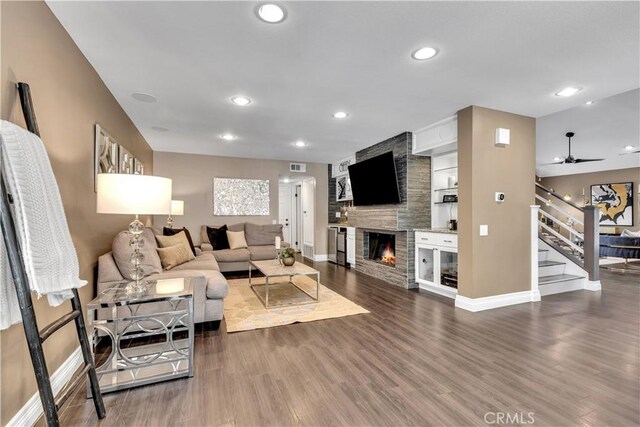 22602 Manalastas Dr, Lake Forest, CA 92630 - living area with stairway, baseboards, a fireplace, wood finished floors, and recessed lighting
